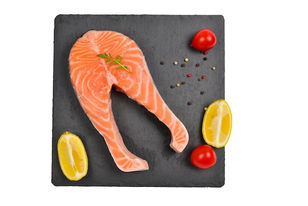 Raw salmon steak isolated on white.