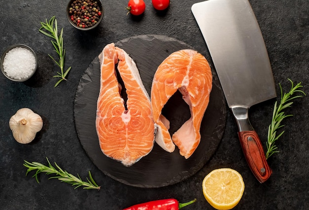 raw salmon steak on stone background