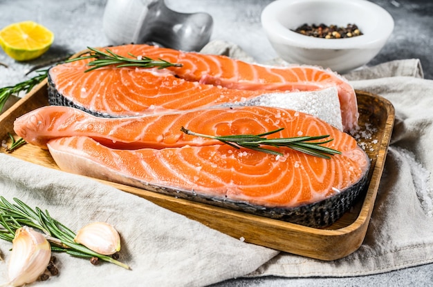 Raw salmon steak on a tray