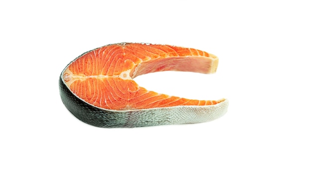 Raw salmon steak on a white background