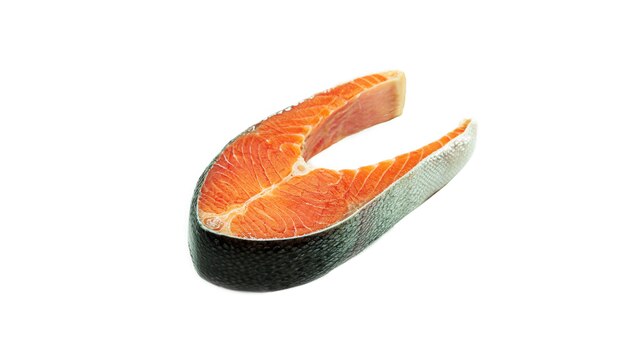 Raw salmon steak on a white background