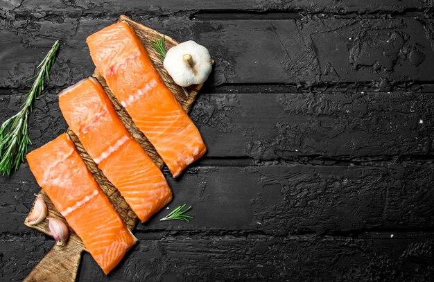 Raw salmon steaks with garlic and rosemary