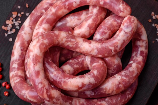 Raw sausages from pork or beef with salt spices and herbs