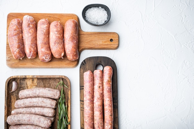 Raw sausages on white background