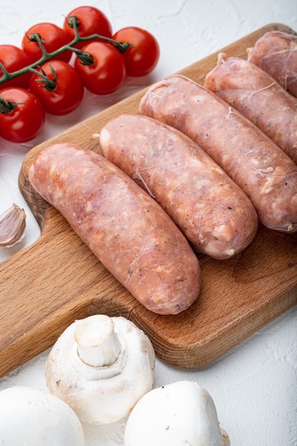 Raw sausages on white background