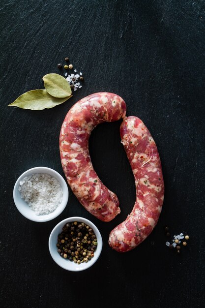 Raw sausages  with herbs and spices