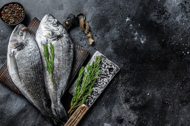 Raw Sea bream dorado fish on a cutting board