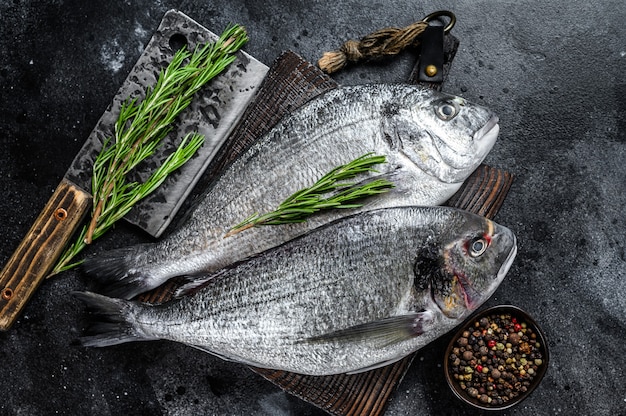 Raw Sea bream dorado fish on a cutting board