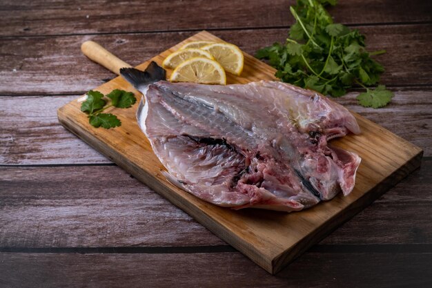 raw sea bream opened in half for grilling