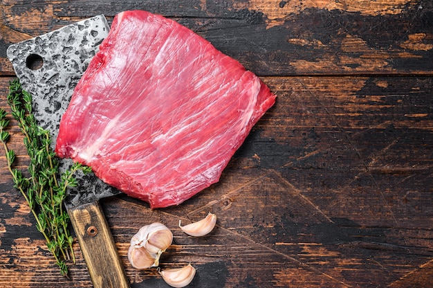 Raw skirt beef marbled meat steak on a cleaver