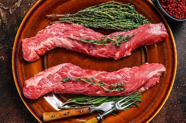 Raw skirt machete beef meat steak on a cutting board