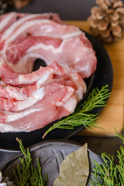 Raw sliced bacon pork for preparing a dinner for a Christmas dishes  with a Christmas decorations