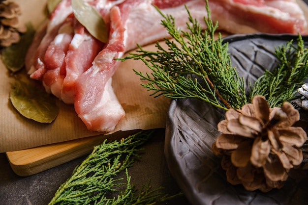 Raw sliced bacon pork for preparing a dinner for a Christmas dishes  with a Christmas decorations