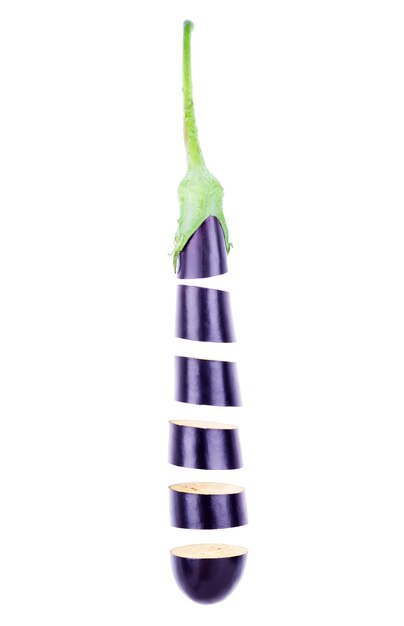 Raw sliced eggplant in flight isolated on a white background