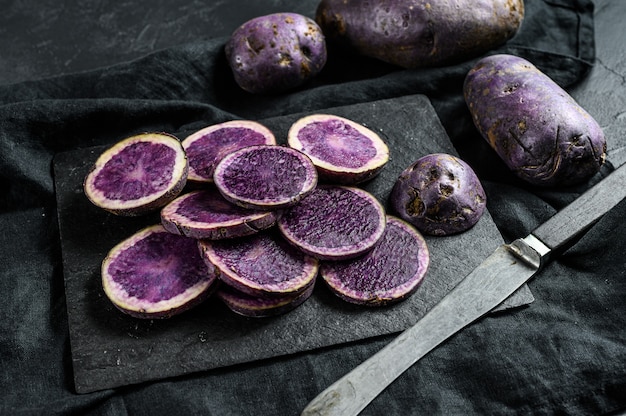 Raw sliced purple potatoes. 