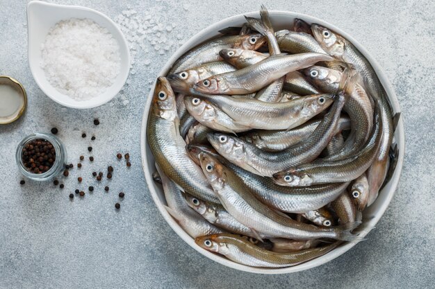 raw Smelt in a bowl near spices