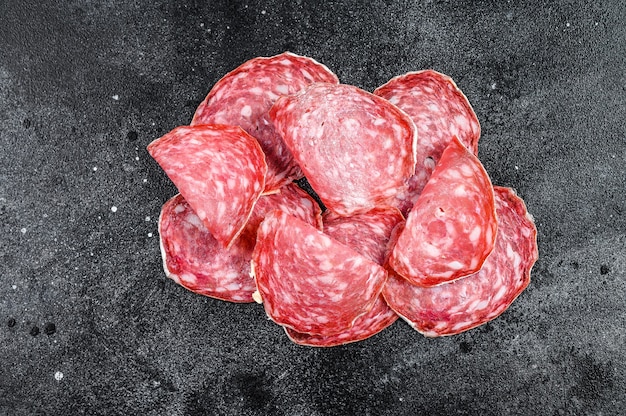 Raw smoked Salami sausage slices pile