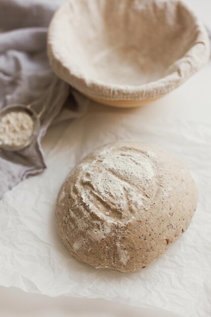 Raw sourdough bread in banneton