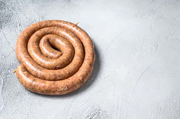 Raw spiral sausage from pork and beef mince meat