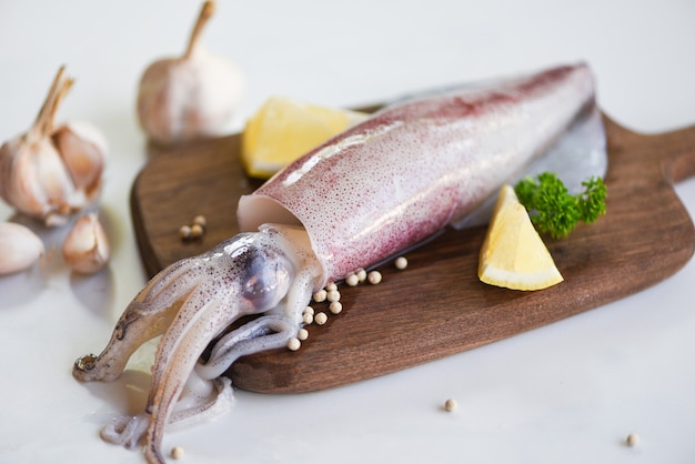 Raw squid on cutting board