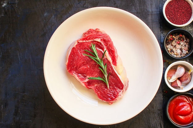 Raw steak fresh beef meat portion on the table healthy meal