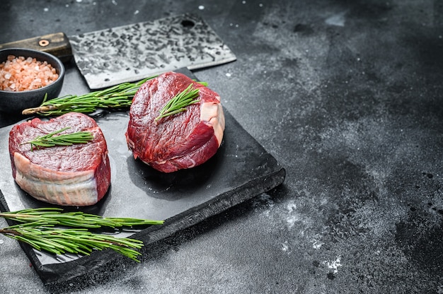 Raw steak Tenderloin fillet on a stone board