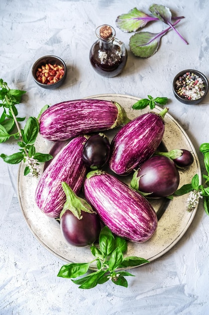 Raw striped eggplants