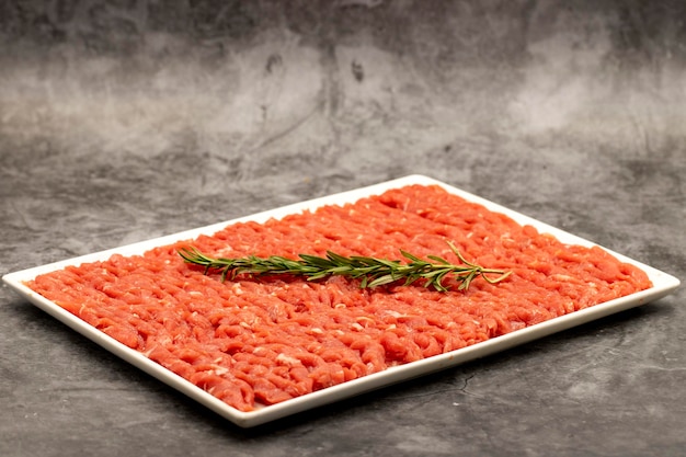 Raw stroganoff or veal julienne on a dark background