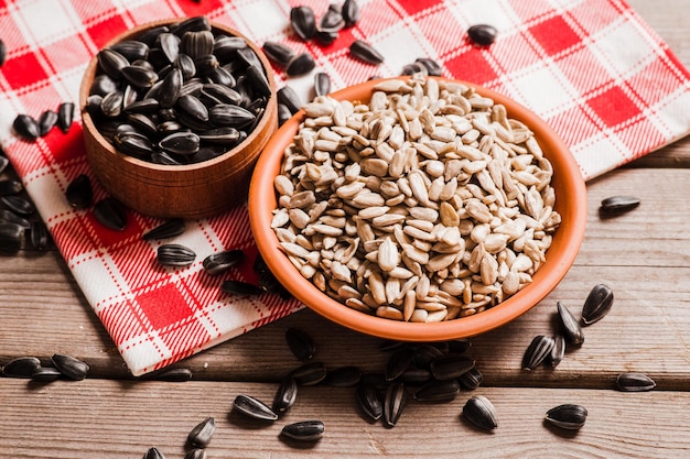 Raw sunflower seeds on table closeup view