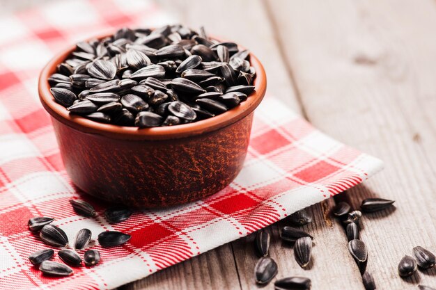 Raw sunflower seeds on table closeup view