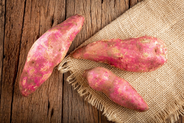 Raw sweet potato on the table