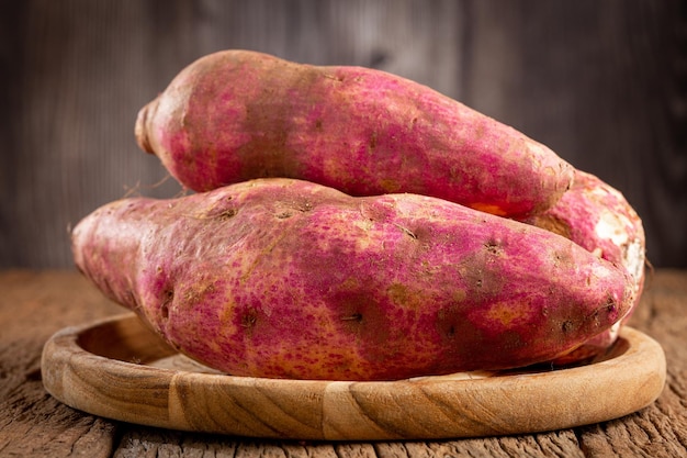 Raw sweet potato on the table