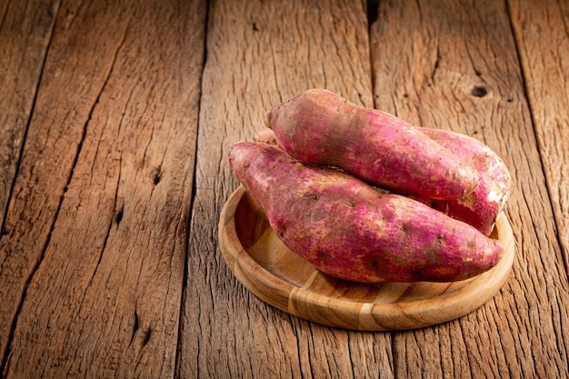 Raw sweet potato on the table