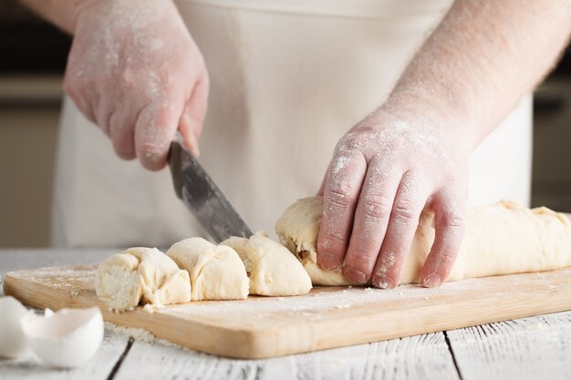 Raw sweet yeast dough on a baking sheet