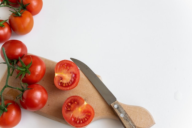 raw tomatoes on white background