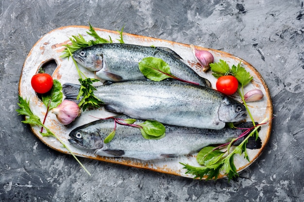 Raw trout on cutting board