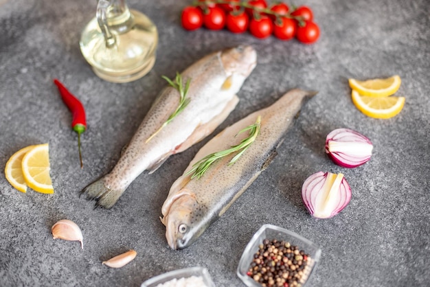 Raw trout fish on stone background