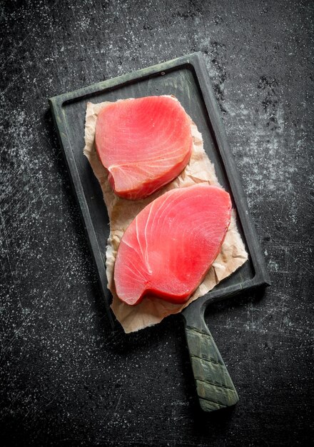 Raw tuna steak on cutting Board