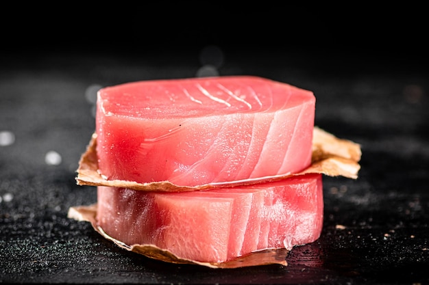 Raw tuna steaks on the table