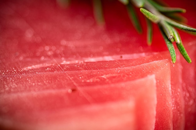 Raw tuna with a sprig of rosemary