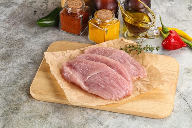 Raw turkey breast fillet steak for cooking