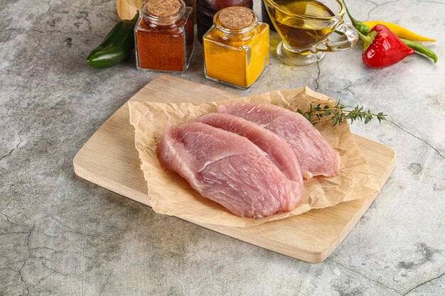 Raw turkey breast fillet steak for cooking