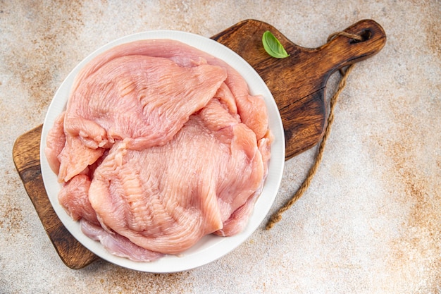 Raw turkey fillet fresh poultry meat slice diet healthy eating cooking appetizer meal food snack