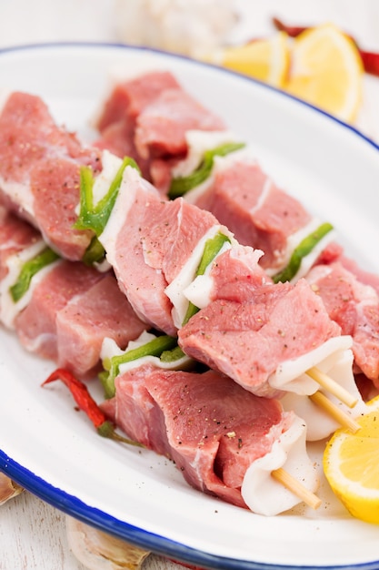 Raw turkey fillet with pepper and lemon