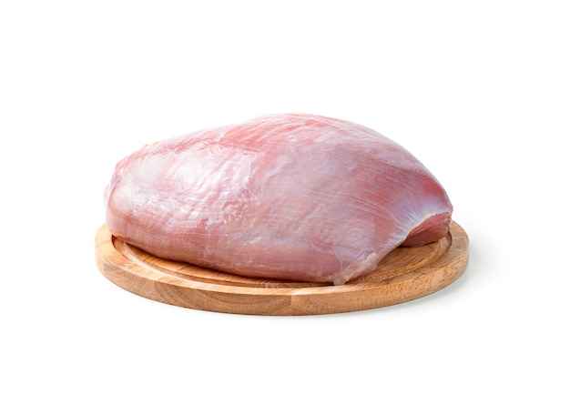 Raw turkey meat on a cutting board isolated