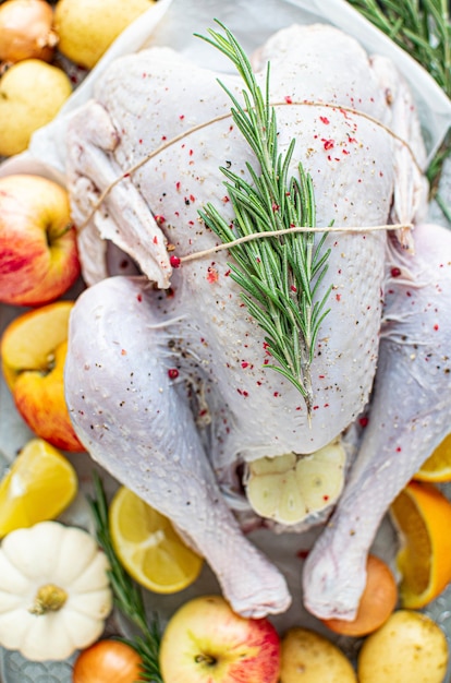 Raw turkey with fresh rosemary