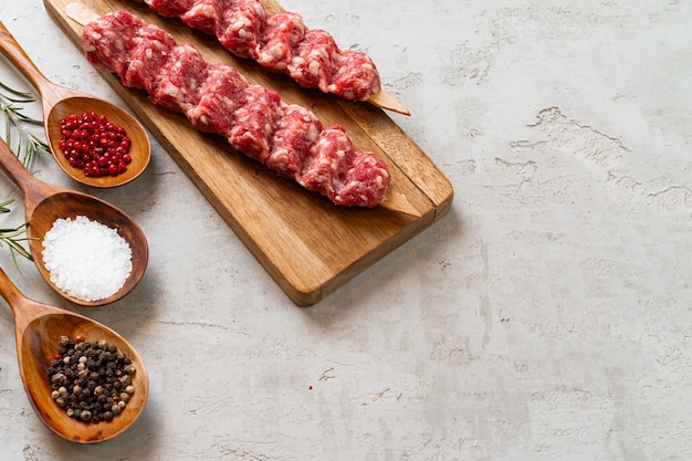 Raw turkish traditional meat kebab on the table. close up