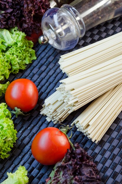 Raw udon noodles and vegetables for cooking dishes