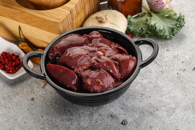 Raw uncooked chicken liver in the bowl