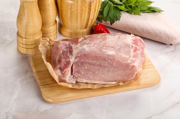 Raw uncooked pork meat loin over board